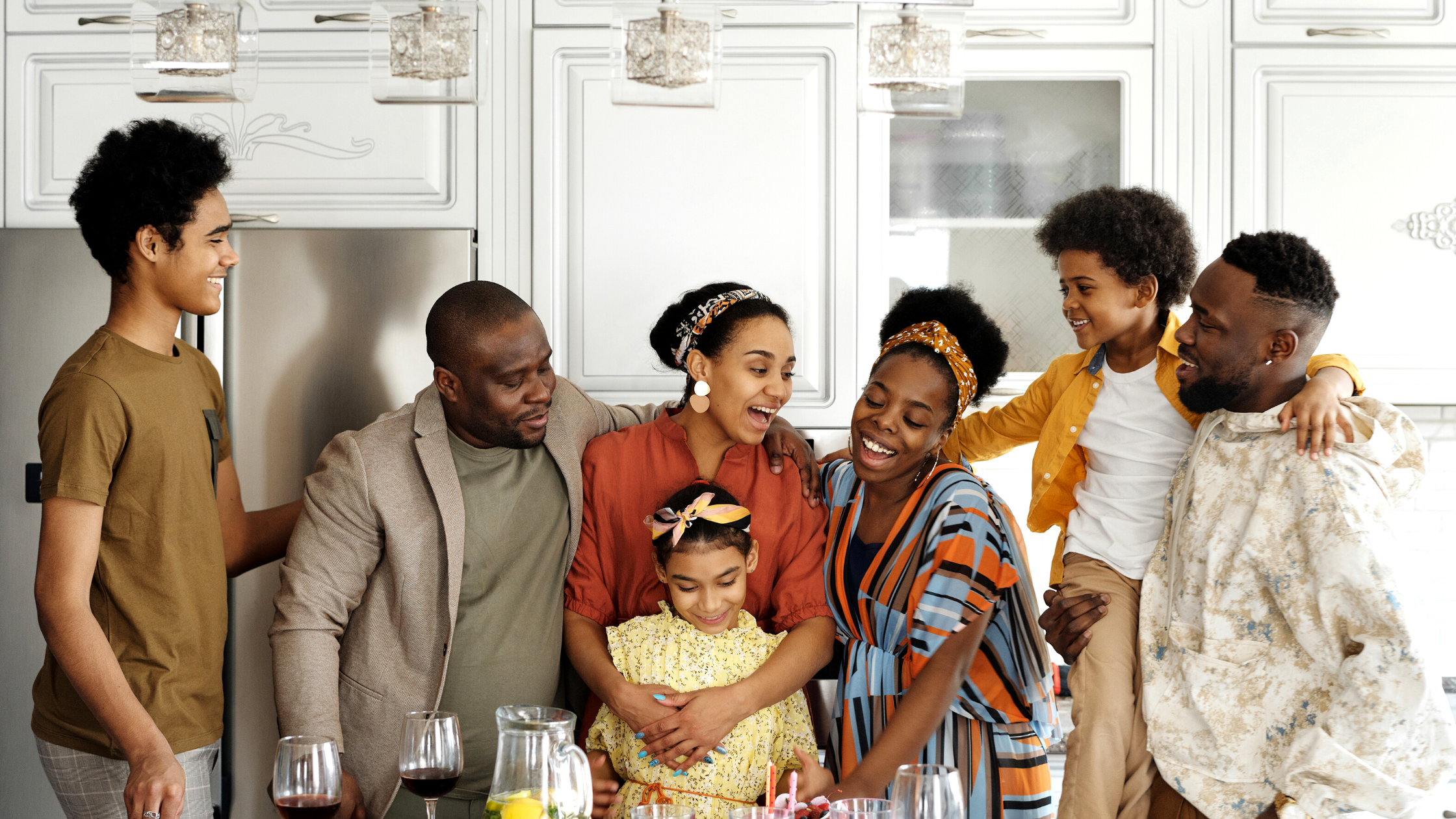 Why Creating A Great Support System Is Important For Families Of Children With Short Bowel Syndrome - Eclipse Regenesis Blog Featured Image A family stands around the kitchen lovingly.