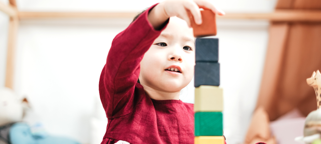 A child plays with blocks