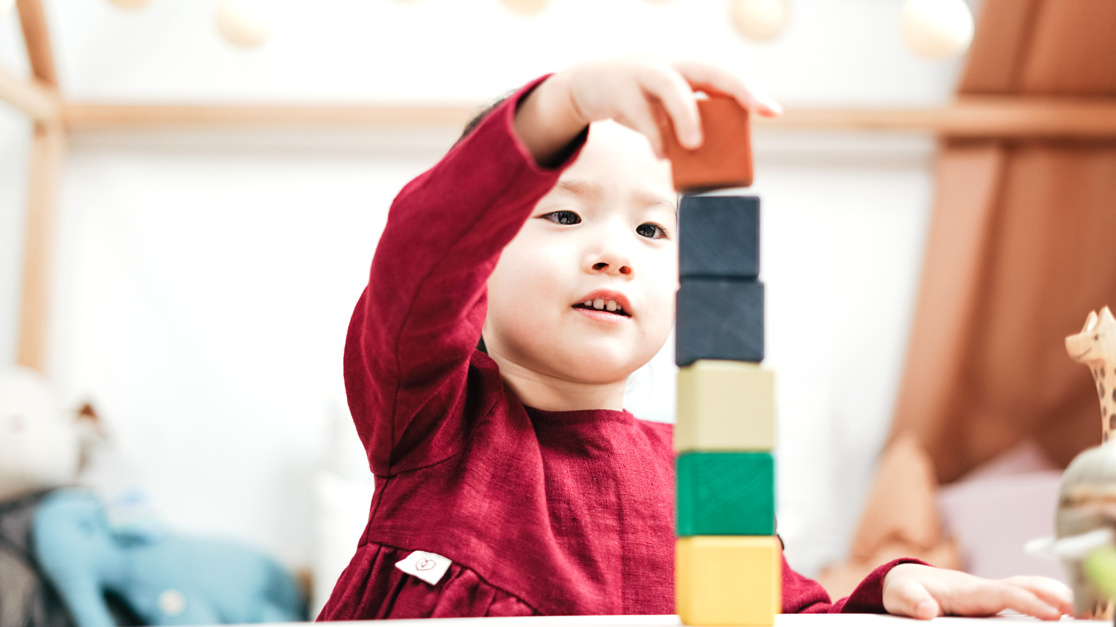 A child plays with blocks